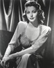 Black and White Portrait of Ava Gardner sitting in Long Dress Photo Print - Item # VARCEL693783