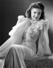 Anne Baxter on a Ruffled Dress sitting Photo Print - Item # VARCEL693847
