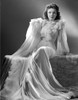 Anne Baxter on a Ruffled Dress smiling in Black and White Portrait Photo Print - Item # VARCEL693855