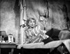 Anne Baxter on Printed Top sitting and Leaning on a Bed Photo Print - Item # VARCEL693915