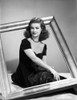 Joan Bennett sitting Pose with a Frame Portrait Photo Print