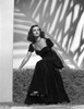 Joan Bennett on a Dress sitting and Leaning Pose Photo Print - Item # VARCEL694110