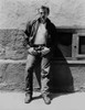 James Dean Posed in Black Velvet Long Sleeve Jacket and Jeans while Leaning on the Wall with Hands on the Pocket Photo Print - Item # VARCEL694182