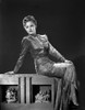Mimi Berry sitting in Black and White Photo Print - Item # VARCEL694202