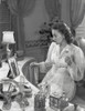 Olivia DeHavilland Seated in Silk Dress Photo Print - Item # VARCEL694361