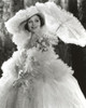 Dolores Del Rio Posed wearing White Gown with Umbrella Photo Print - Item # VARCEL694425