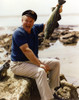 Gilligan's Island Alan Hale Jr With Fish sitting Holding a Fish Photo Print - Item # VARCEL694471
