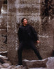 Benicio Del Toro Leaning on Wall in Black Coat Photo Print - Item # VARCEL694559