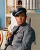 Dom Deluise in Police Uniform with Banana Photo Print - Item # VARCEL694654