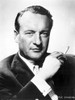 A Portrait Of George Sanders Smoking A Cigarette Photo Print - Item # VARCEL694656
