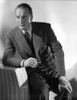 A Portrait Of George Sanders Smoking A Cigarette Photo Print - Item # VARCEL694683