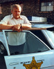 Brian Dennehy Leaning on Police Car Photo Print - Item # VARCEL694789