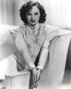 Paulette Goddard Seated on Couch wearing Formal Dress Portrait Photo Print - Item # VARCEL694826