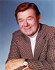 Portrait of Arthur Godfrey Posed in Coat with Blue Background Photo Print - Item # VARCEL694864