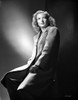 Hillary Brooks sitting in Coat Photo Print - Item # VARCEL694903