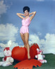 Gila Golan Posed in Pink Dress with Clouds Background Photo Print - Item # VARCEL694928