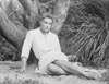 Angie Dickinson sitting on Sand Black and White Photo Print - Item # VARCEL695089