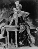 Marlene Dietrich Leaning on a Table wearing Glittery Blazer in Black and White Photo Print - Item # VARCEL695305