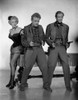 Marlene Dietrich standing with Two Men Holding Pistols Photo Print - Item # VARCEL695343
