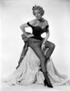 Marlene Dietrich Seated on a Cloth Chair wearing Black Dress Photo Print - Item # VARCEL695398