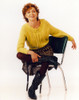Grace Under Fire Woman Posed in Green Knitted Top Leg Crossed Photo Print - Item # VARCEL695404