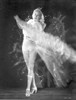 Gloria Grahame Waving Hand in a White Gown Photo Print - Item # VARCEL695640