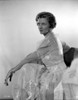 Irene Castle sitting in Sideview Pose in Shining and See Through Gown Photo Print - Item # VARCEL695783