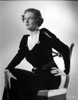 Irene Castle sitting on a Wooden Chair in Black Dress Photo Print - Item # VARCEL695791