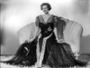 Irene Castle sitting on a Couch in Gown Photo Print - Item # VARCEL695817