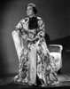 Irene Castle sitting on an Arm Rest in Printed Gown Photo Print - Item # VARCEL695870