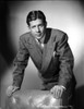 A Portrait Of Rudy Vallee Leaning on A Chair Photo Print - Item # VARCEL695897