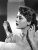 Peggy Castle Holding Face Mirror in Black and White Portrait Photo Print - Item # VARCEL695919