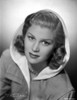 Joan Caulfield wearing a Coat with a Beaded Necklace in a Classic Portrait Photo Print - Item # VARCEL695992