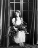 Mary Pickford sitting and Carrying Flowers Photo Print - Item # VARCEL703098