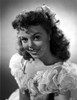 Jean Porter Portrait in White Ruffled Off Shoulder Dress Photo Print - Item # VARCEL703150