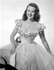 Mala Powers smiling in White Gown with Necklace Photo Print - Item # VARCEL703266