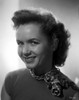 Debbie Reynolds on a Checkered Handkerchief Around Neck and smiling Photo Print - Item # VARCEL703600