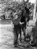 Beverly Roberts standing Along with Horse Photo Print