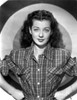Gail Russell Posed in Checkered Shirt with Target Background Photo Print - Item # VARCEL703980