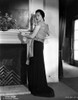 Sylvia Sidney Leaning on a Fireplace in Black Long Skirt Photo Print - Item # VARCEL704477