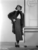 Sylvia Sidney wearing a Furry Coat with Printed Skirt and Hand Waist Photo Print - Item # VARCEL704525