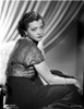 Sylvia Sidney sitting in a Black Skirt and Shining Blouse Photo Print - Item # VARCEL704517
