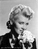 Penny Singleton smiling with Flower Close Up Portrait Photo Print - Item # VARCEL704625