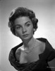 Jean Simmons Portrait in Black Linen Shoulder Dress and Necklace with Pearl Earrings Photo Print - Item # VARCEL704687
