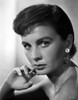 Jean Simmons Portrait in Black Off Shoulder Dress and Coin Earrings with Right Hand on the Chin Photo Print - Item # VARCEL704689