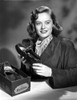 Alexis Smith Holding a Shoe while smiling in a Classic Portrait Photo Print - Item # VARCEL704752
