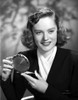 Alexis Smith smiling while Holding a Make up Kit Photo Print - Item # VARCEL704760