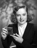 Alexis Smith Putting a Make Up While smiling Photo Print - Item # VARCEL704772