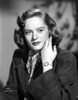 Alexis Smith Posed in Black Coat wearing a Wrist Watch Photo Print - Item # VARCEL704766
