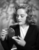 Alexis Smith Looking in a Small Mirror wearing Black Suit Photo Print - Item # VARCEL704787